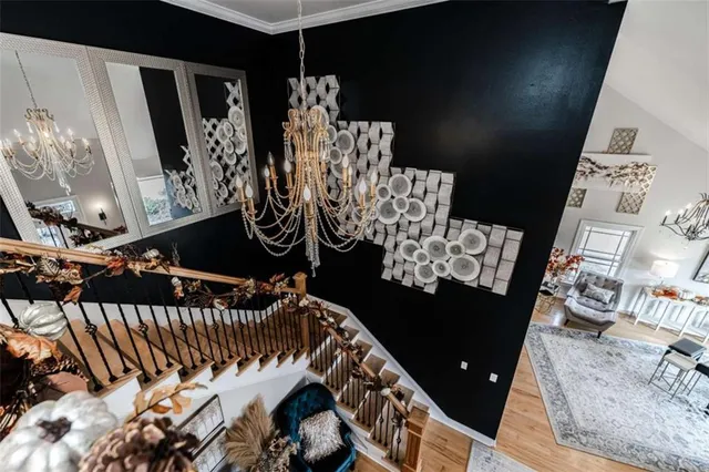 a living room with patio furniture and a large window