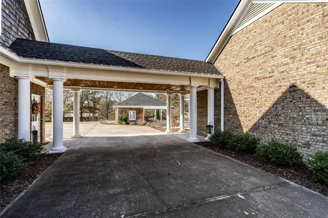 a view of a patio with table and chairs and potted plants