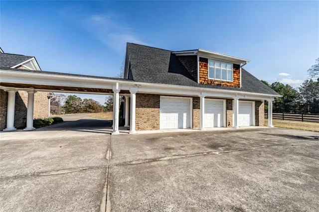 a view of swimming pool with outdoor seating and plants