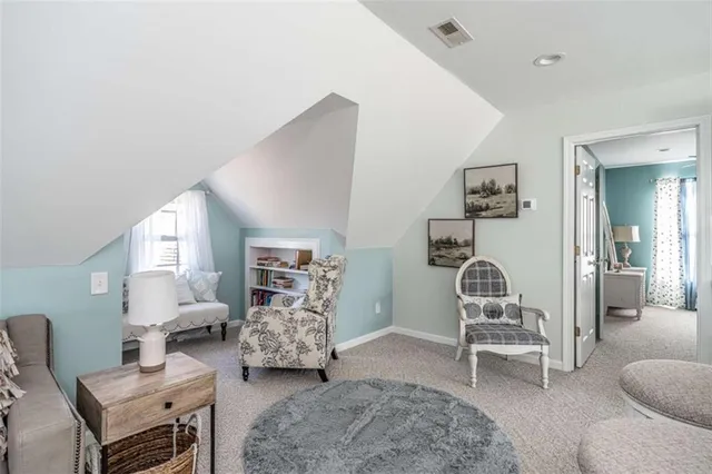 a view of a patio with table and chairs floor to ceiling window with wooden floor