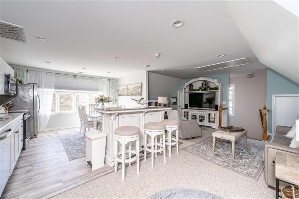 159 Ward Mountain Road Kingston, GA 30145 - Photo 47 of 75 a kitchen with stainless steel appliances kitchen island granite countertop a dining table chairs and view living room