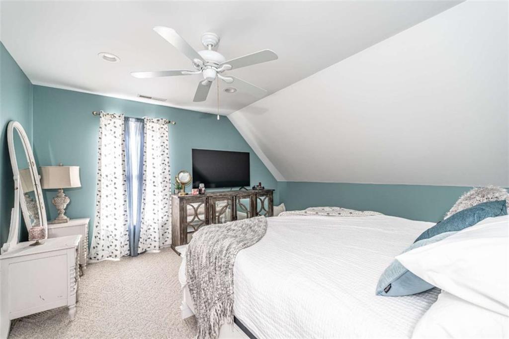 159 Ward Mountain Road Kingston, GA 30145 - Photo 50 of 75 a bedroom with a bed and a flat screen tv