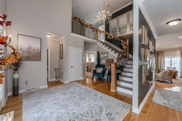 a living room with furniture fireplace and a large window