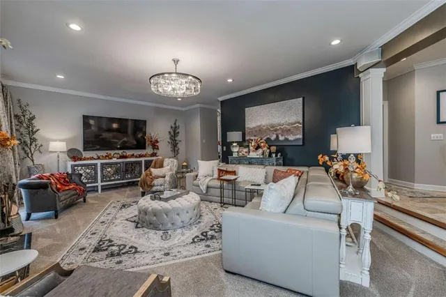a dining room with furniture and a kitchen view