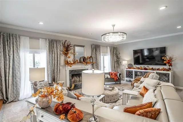 a large white kitchen with a sink and cabinets
