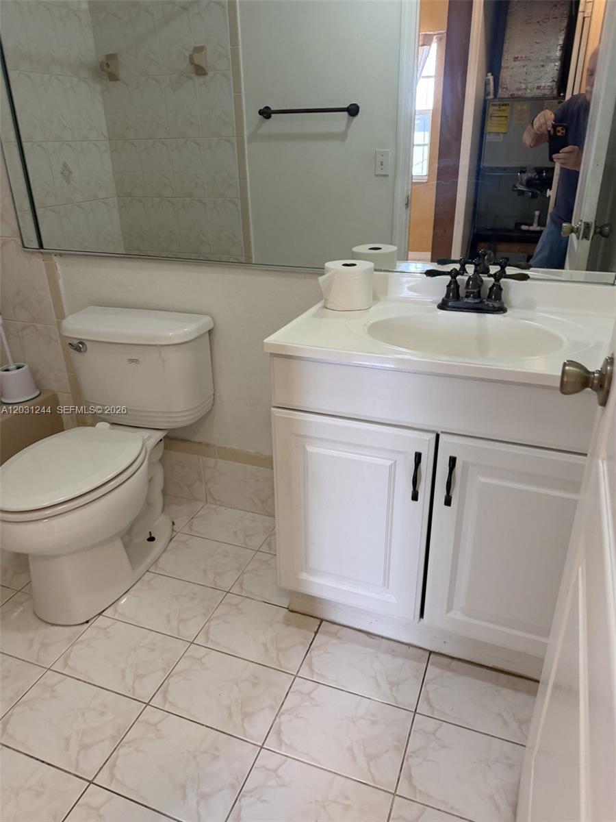 13752 Southwest 156th Street Miami, FL 33177 - Photo 14 of 14 a bathroom with a sink toilet and shower