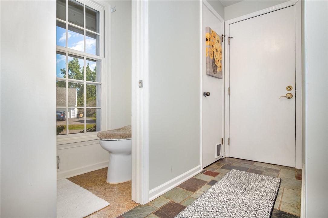 5 Old Drake Run Perinton, NY 14450 - Photo 19 of 39 HALL FROM GARAGE WITH 1/2 BATH