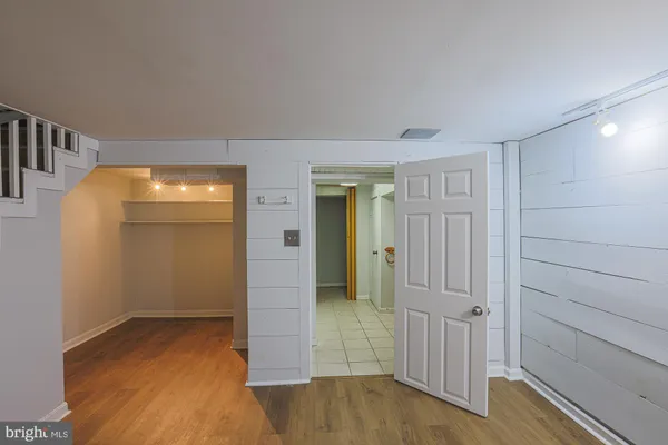 wooden floor in a hall with an entryway and a wooden floor