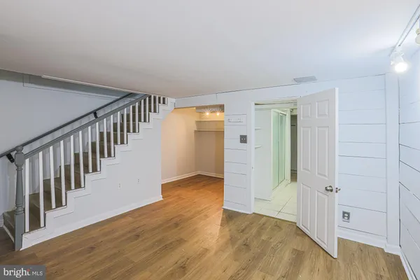 wooden floor in a hall with a window