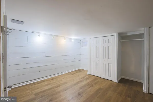 a bathroom with a sink toilet and mirror