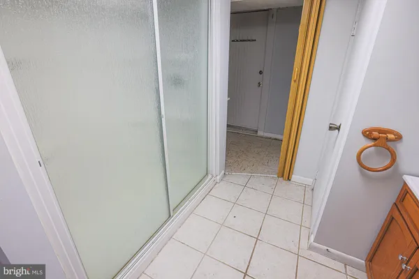 a white toilet sitting next to a bathroom sink