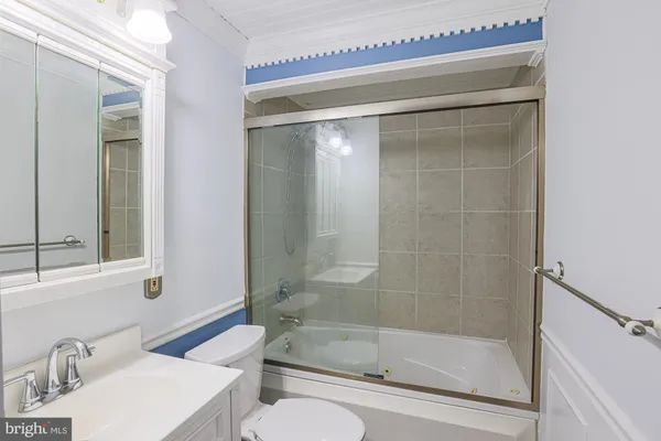 a view of front door of a house with wooden fence