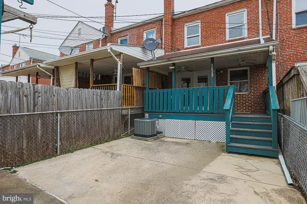 a view of balcony with wooden floor