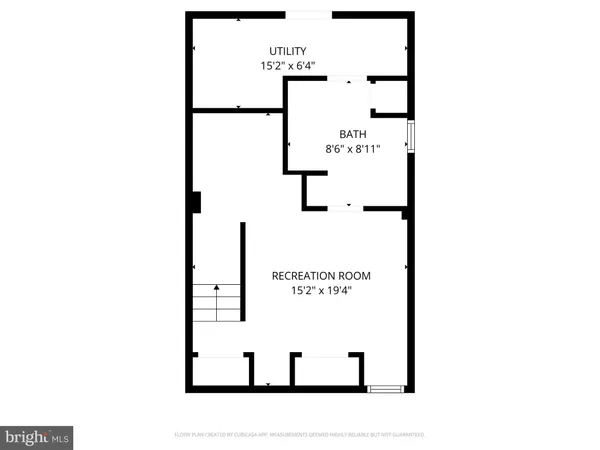 a picture of a bench in front of a wall