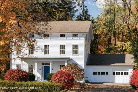 a view of a house with a tree