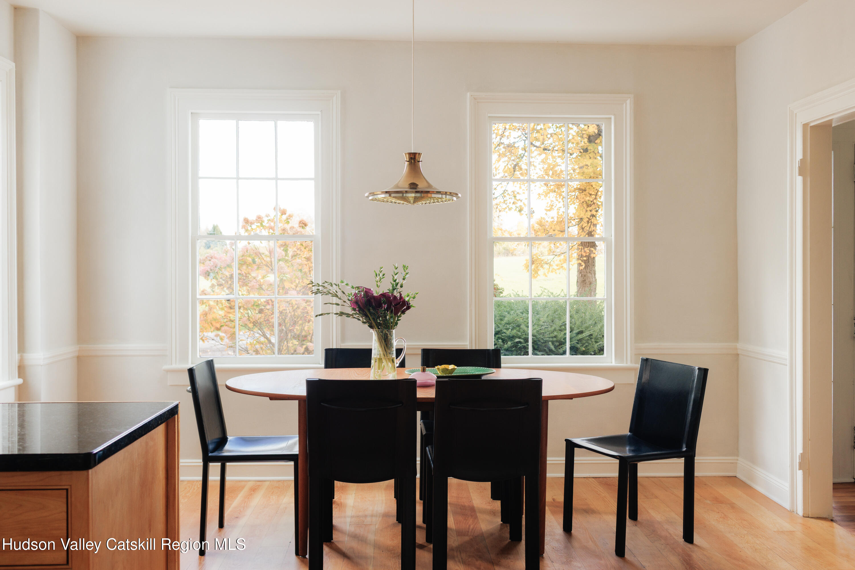 202 Blue Hill Road Hudson, NY 12534 - Photo 11 of 27 a view of a dining room with furniture and a window
