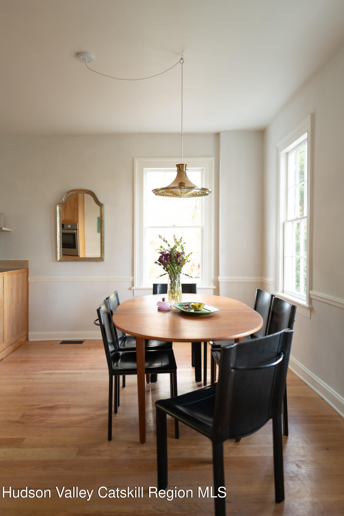 202 Blue Hill Road Hudson, NY 12534 - Photo 12 of 27 a view of a dining room with furniture window and wooden floor