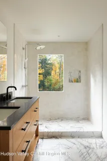 a bathroom with a sink and a large mirror