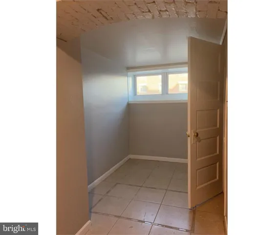 a view of an empty room with windows