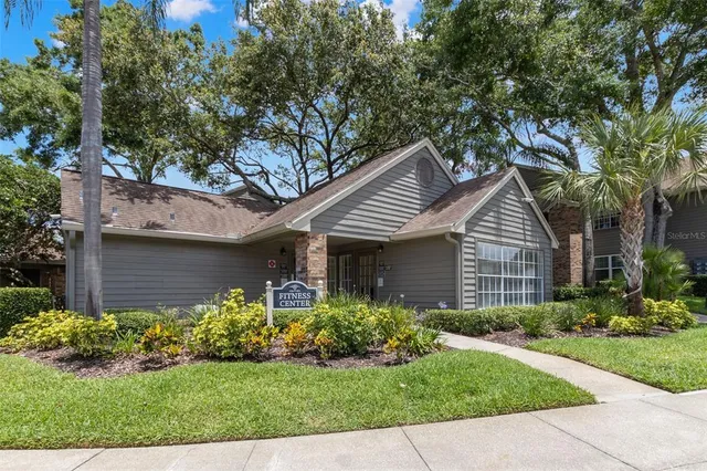 a front view of house with a garden