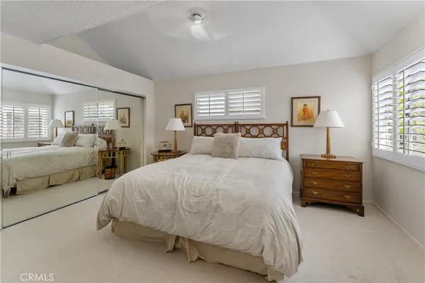 a bedroom with a bed and a couch