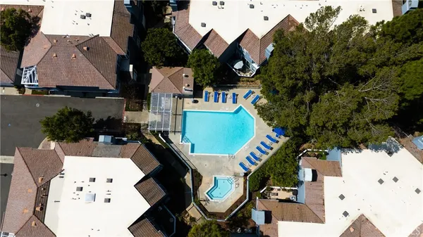 an aerial view of a house with outdoor space and sitting area