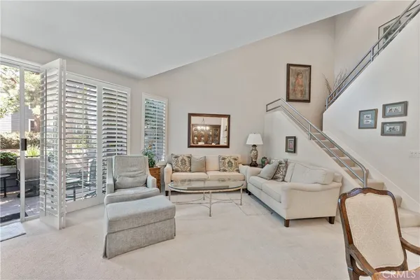a living room with furniture or couch and a large window