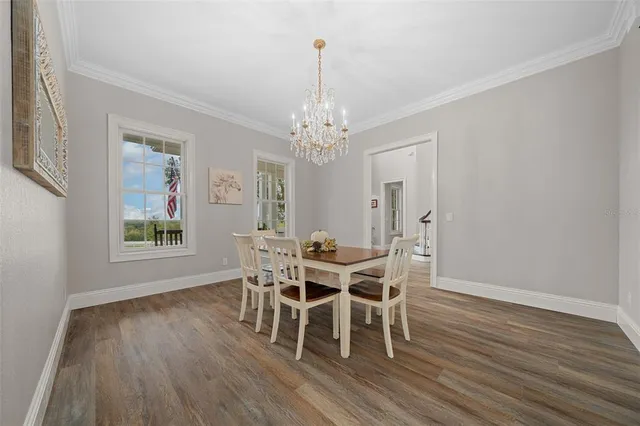 a living room with furniture a fireplace and a large window