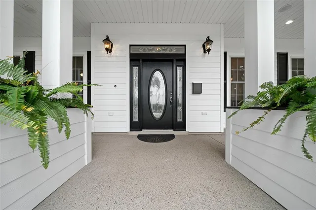 a view of a house with a fountain in front of a house