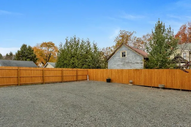 a view of backyard and tree