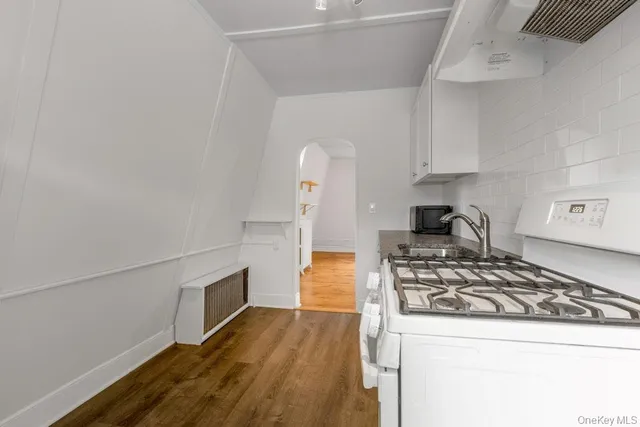 a kitchen with a stove and a refrigerator