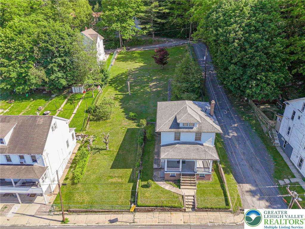 159 West Ridge Street Nesquehoning, PA 18240 - Photo 43 of 55 An inviting facade and generous yard space define this charming residential property.