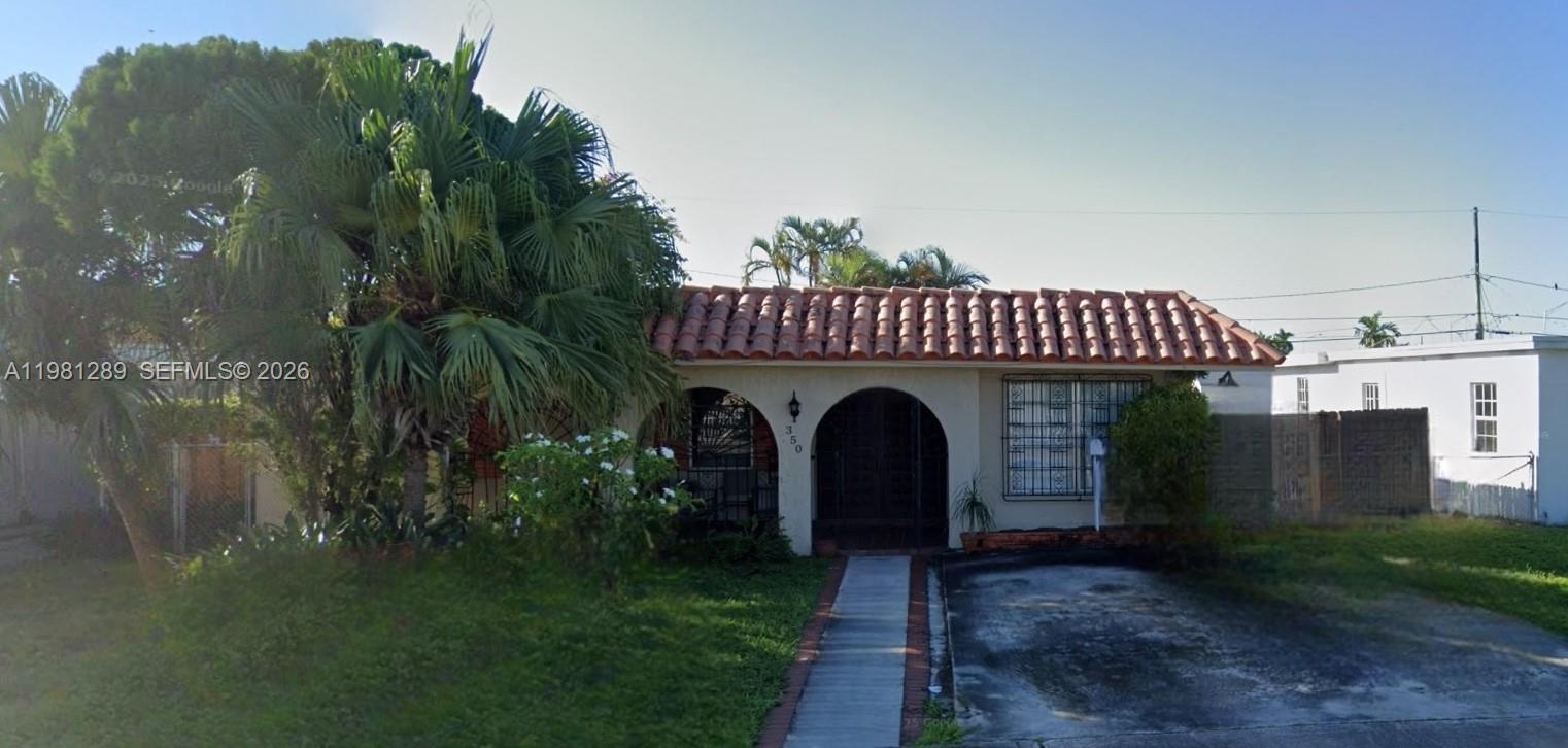 350 West 34th Street, Unit 2 Hialeah, FL 33012 - Photo 1 of 1 a view of a house with a yard and tree s
