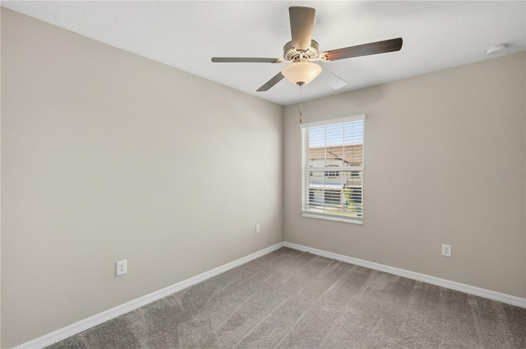 14316 Easy Goer Street Sun City Center, FL 33573 - Photo 16 of 26 a view of an empty room with a window