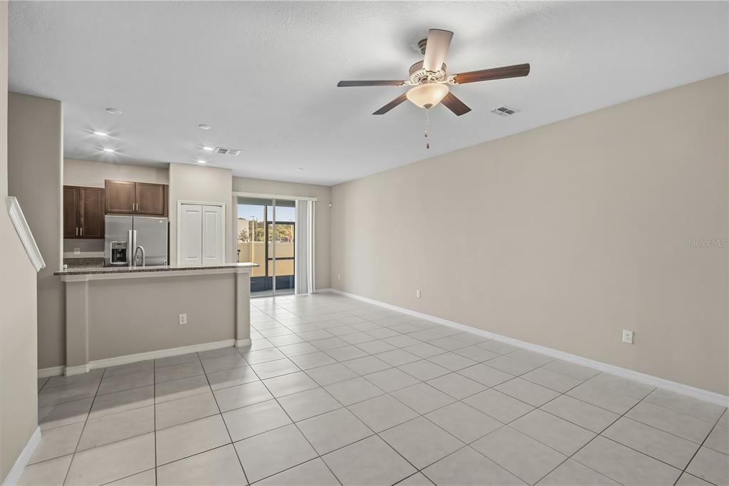 14316 Easy Goer Street Sun City Center, FL 33573 - Photo 10 of 26 a view of kitchen with windows and ceiling fan