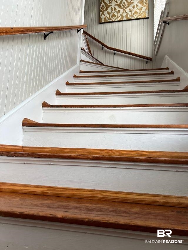 54 South Catherine Street Mobile, AL 36604 - Photo 30 of 55 Stairs show the Craftsman spirit in the natural wood finish and the bead board on the wall. Just another lovely feature!