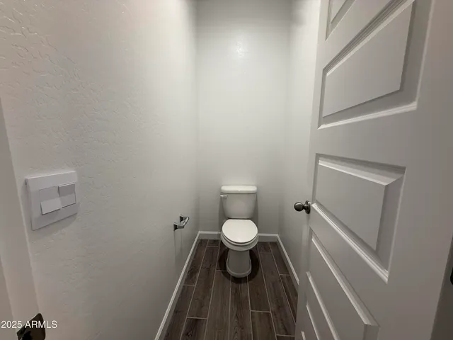 a bathroom with a toilet and a sink