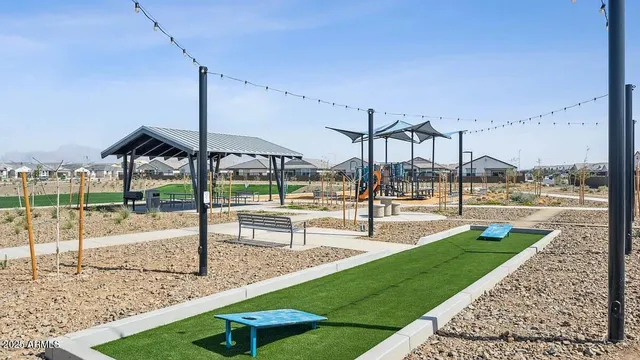 a living room with fireplace furniture and a large window