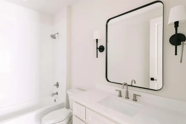 front view of a brick house with a large window