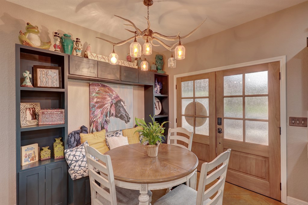 8177 Wendel Road Harper, TX 78631 - Photo 10 of 32 a view of a dining room with furniture and a chandelier