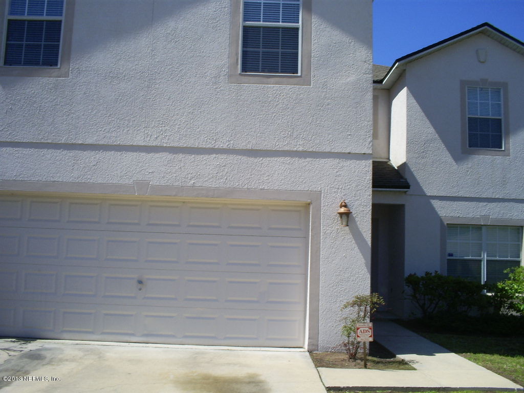9140 Raptor Drive Jacksonville, FL 32221 - Photo 1 of 2 a front view of a house with a yard