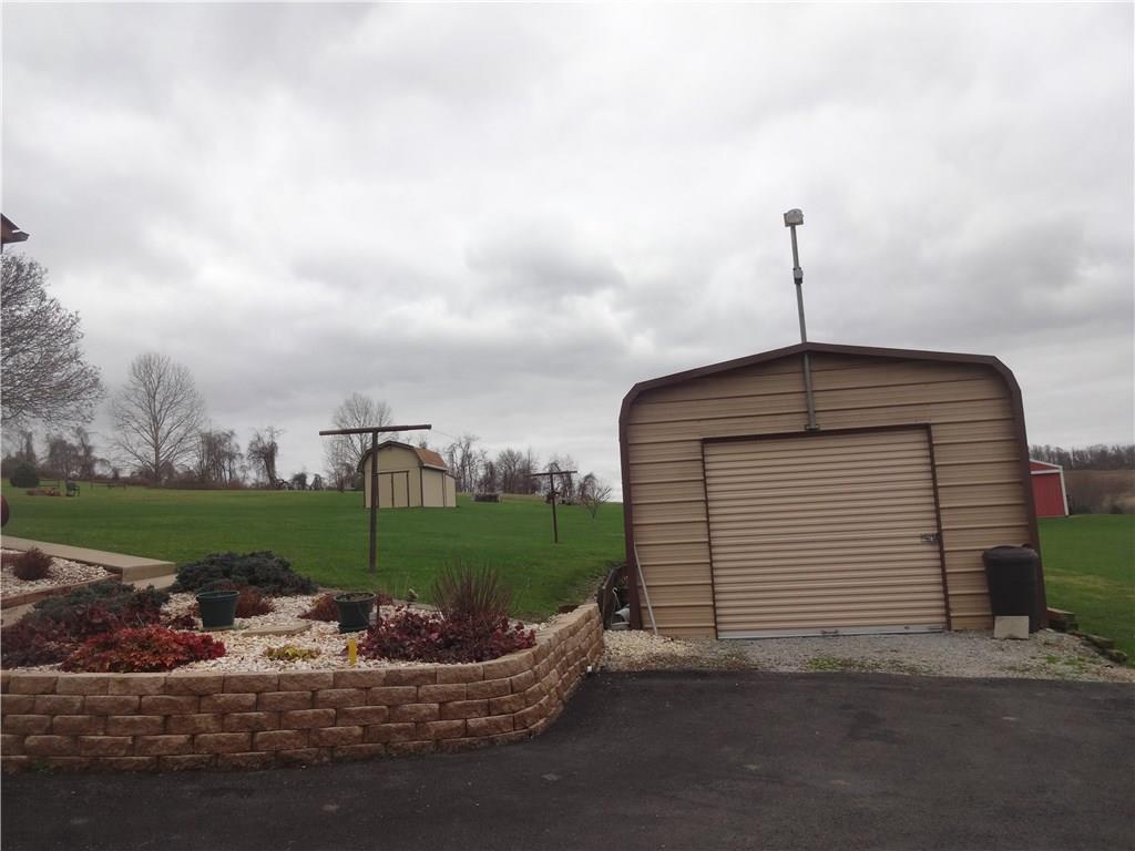 130 Spring Street Yukon, PA 15698 - Photo 9 of 12 Metal garage and driveway