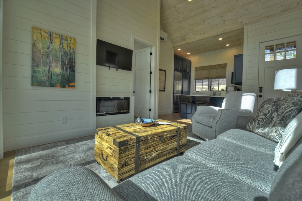 400 Old Toccoa Loop Mineral Bluff, GA 30559 - Photo 3 of 17 a living room with furniture and a flat screen tv