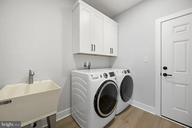 a view of a lake with boats and trees in the background