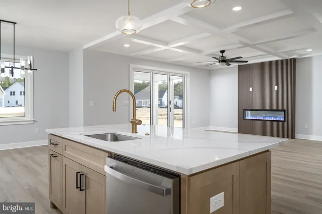 a bathroom with a shower sink and mirror