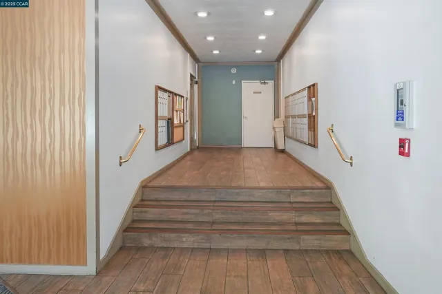 a view of a porch with furniture and a yard