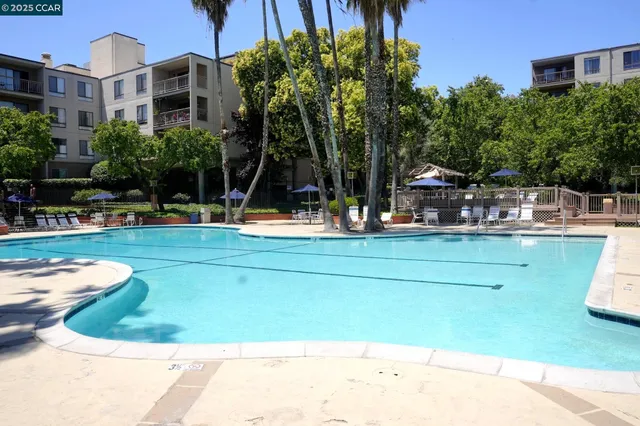 a view of a swimming pool with a patio