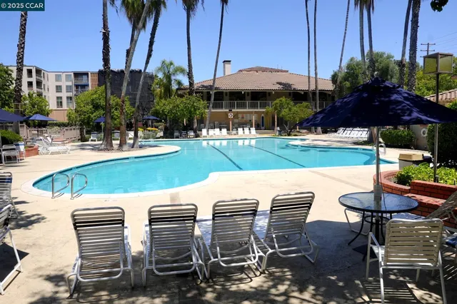a view of a house with a yard and balcony
