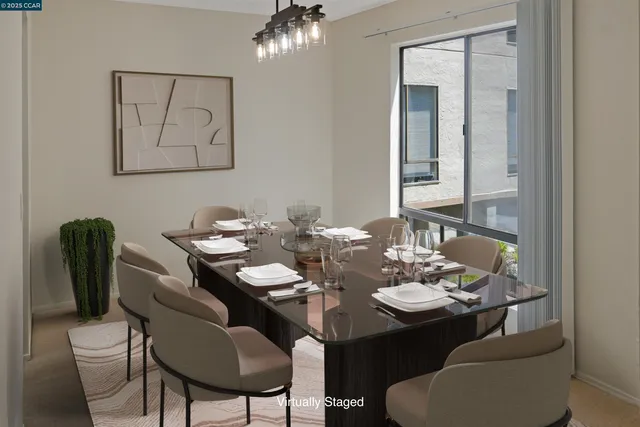 a dining room with furniture and a mirror