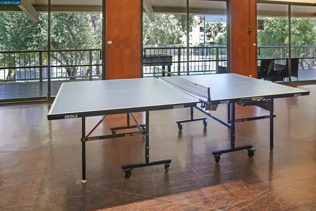 a view of a balcony with wooden floor